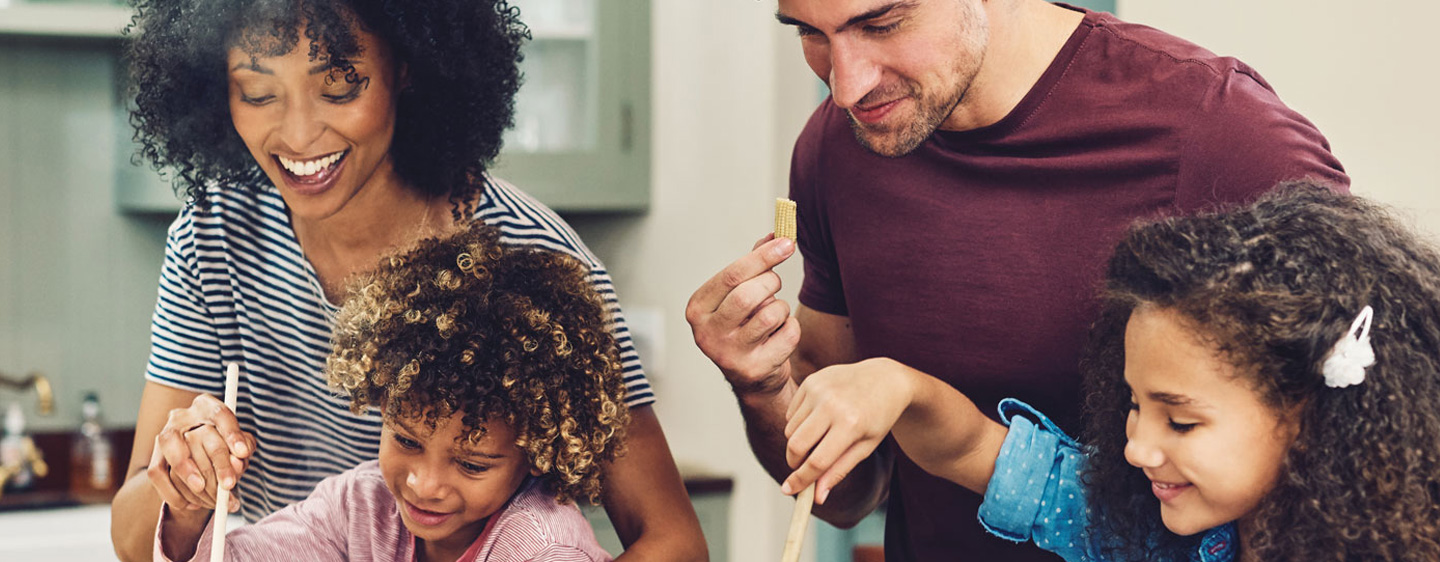 Family prepares dinner together.