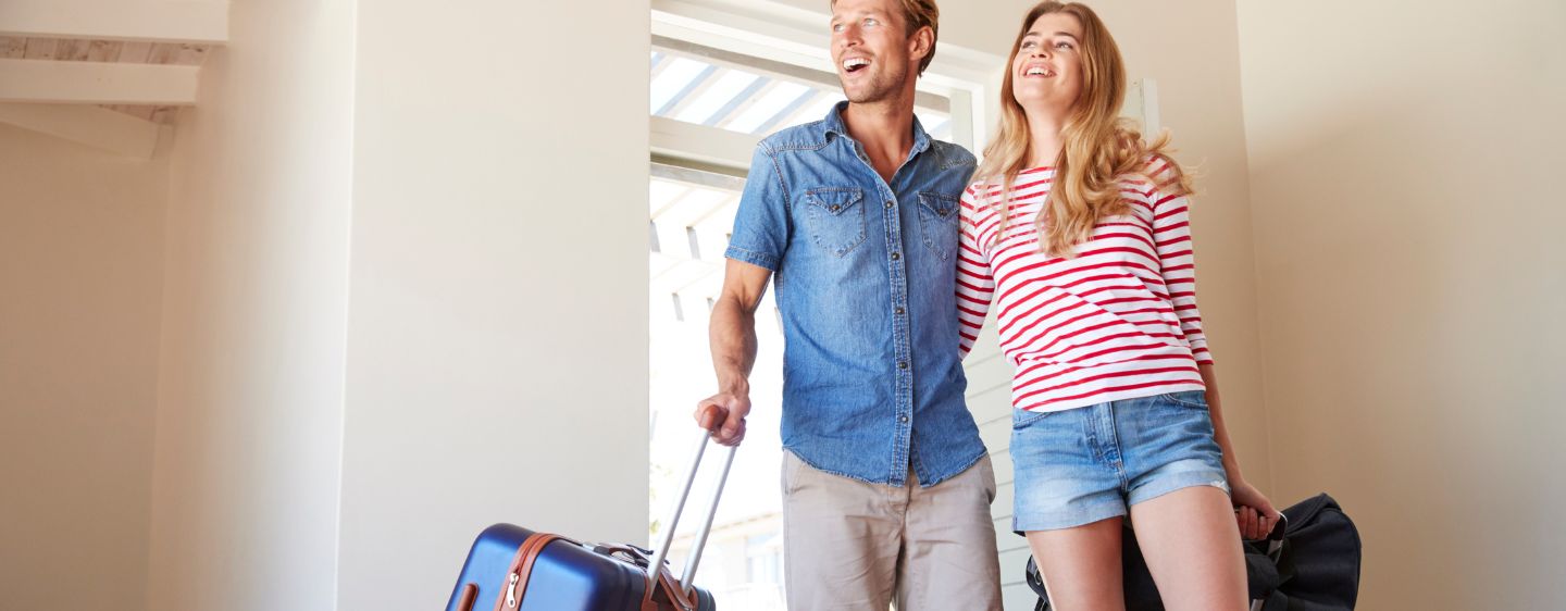 Couple arriving at vacation rental.