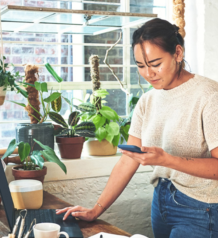 Woman business owner on her phone.