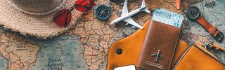 Hat, airplane, passport -- symbolizing spring break travel. 