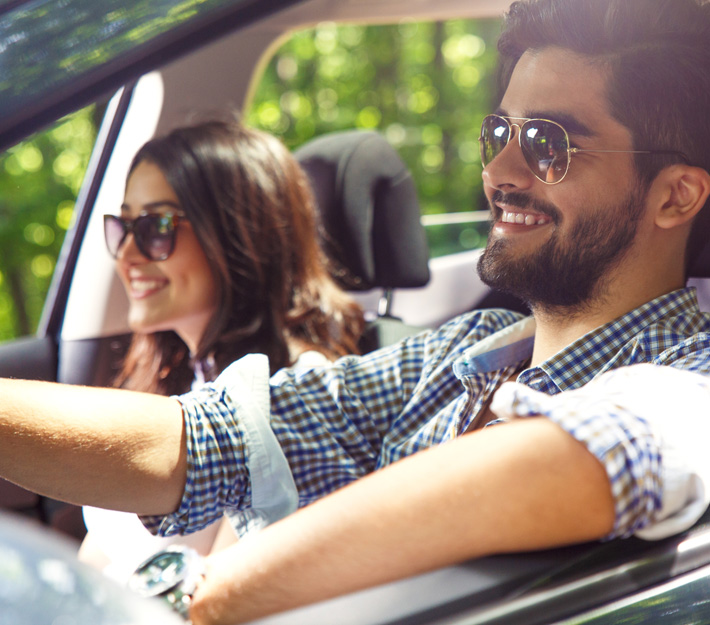 Man and woman drive in a car together.