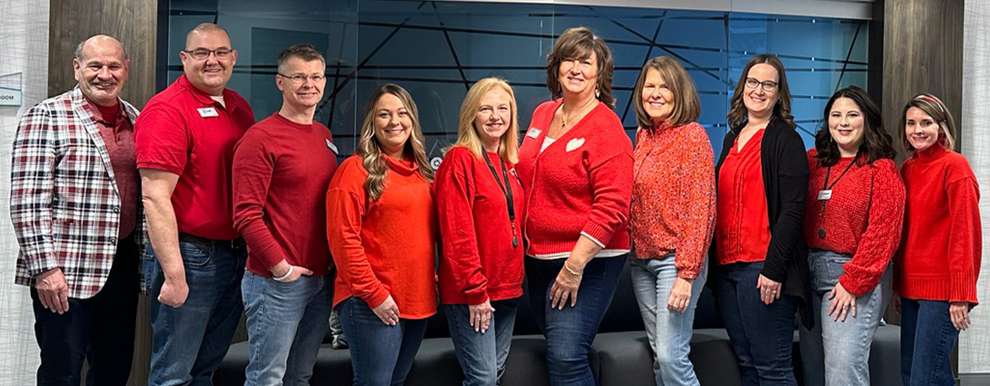 Image of CCU leadership and team members in red.