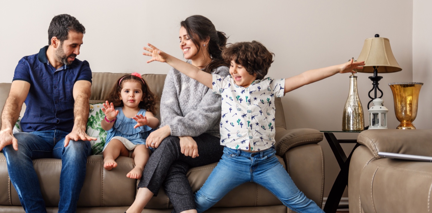 family sitting on couch