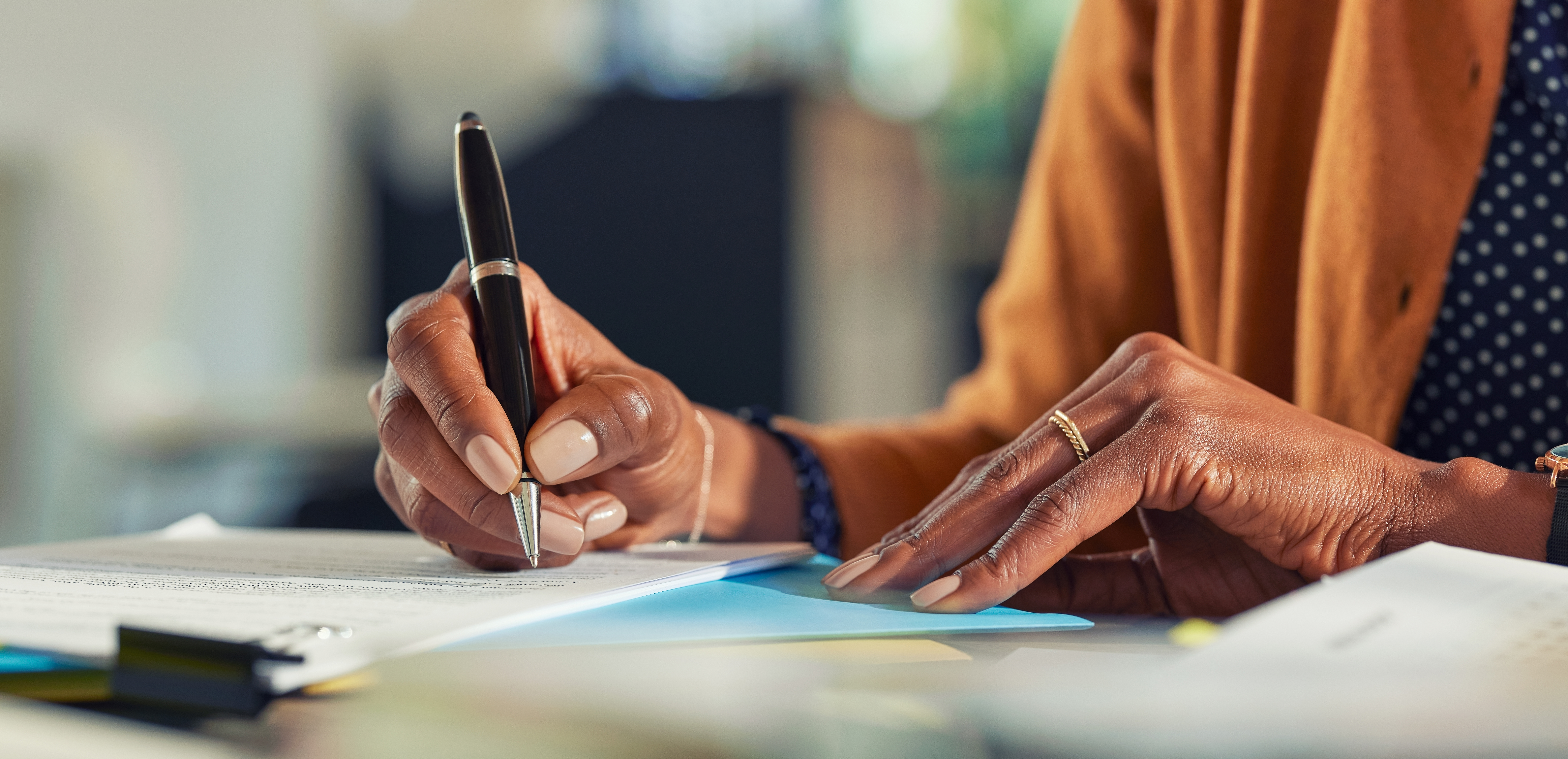 Individual signing paper. 