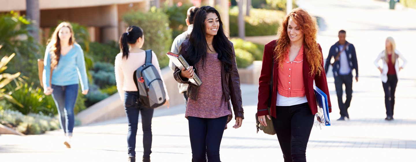 Students walking on a college campus.