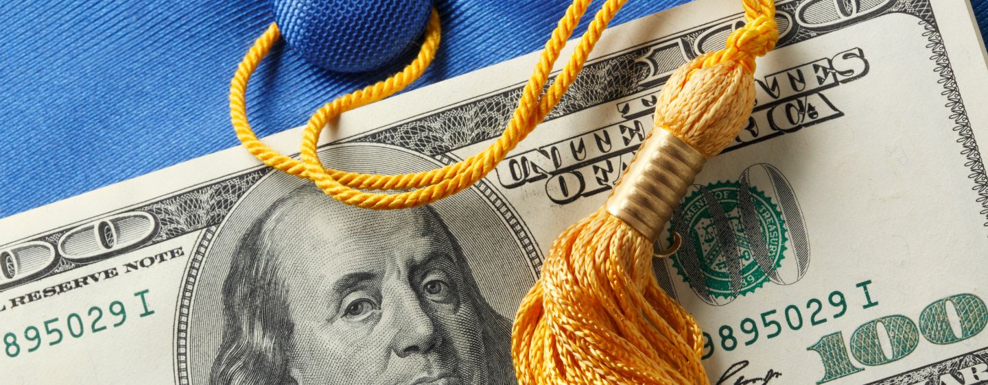 Money and graduation tassel.