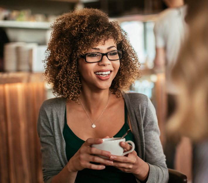 Woman enjoying coffee.