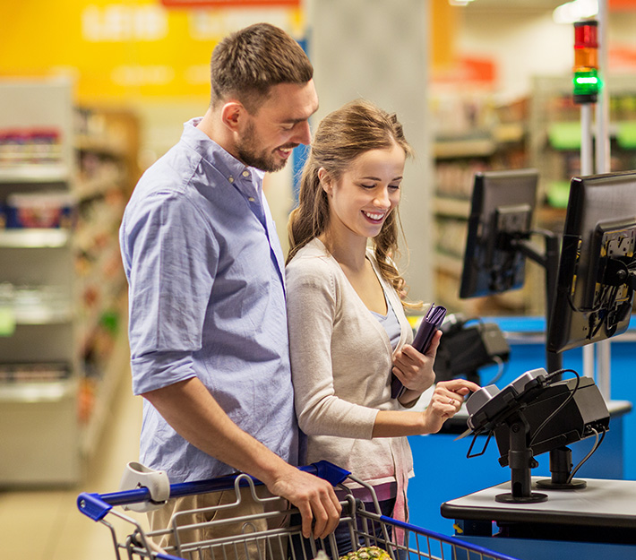 Couple checking out at grocery store