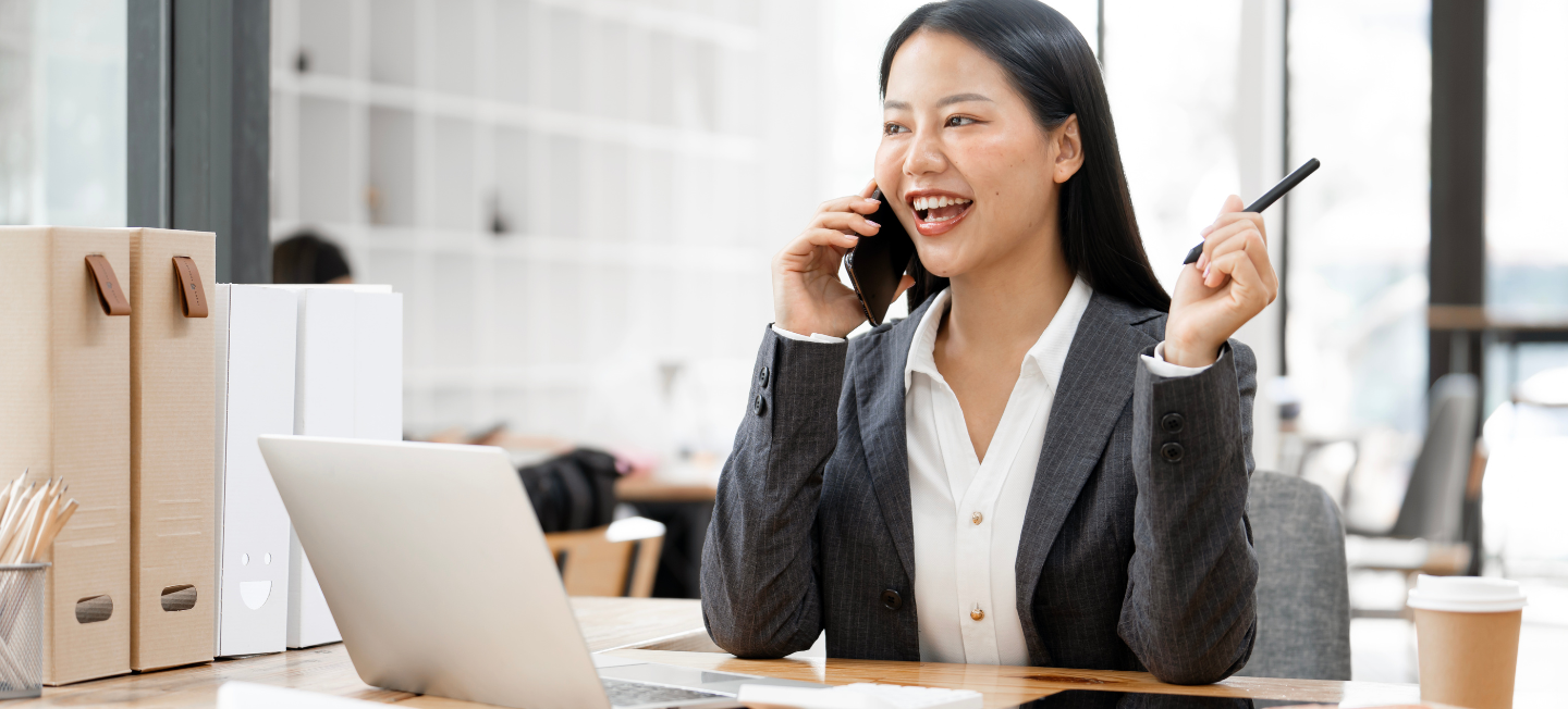 Individual making phone call in office. 