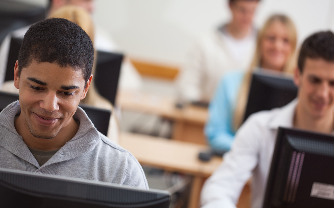 Guys sitting in computer lab - BC