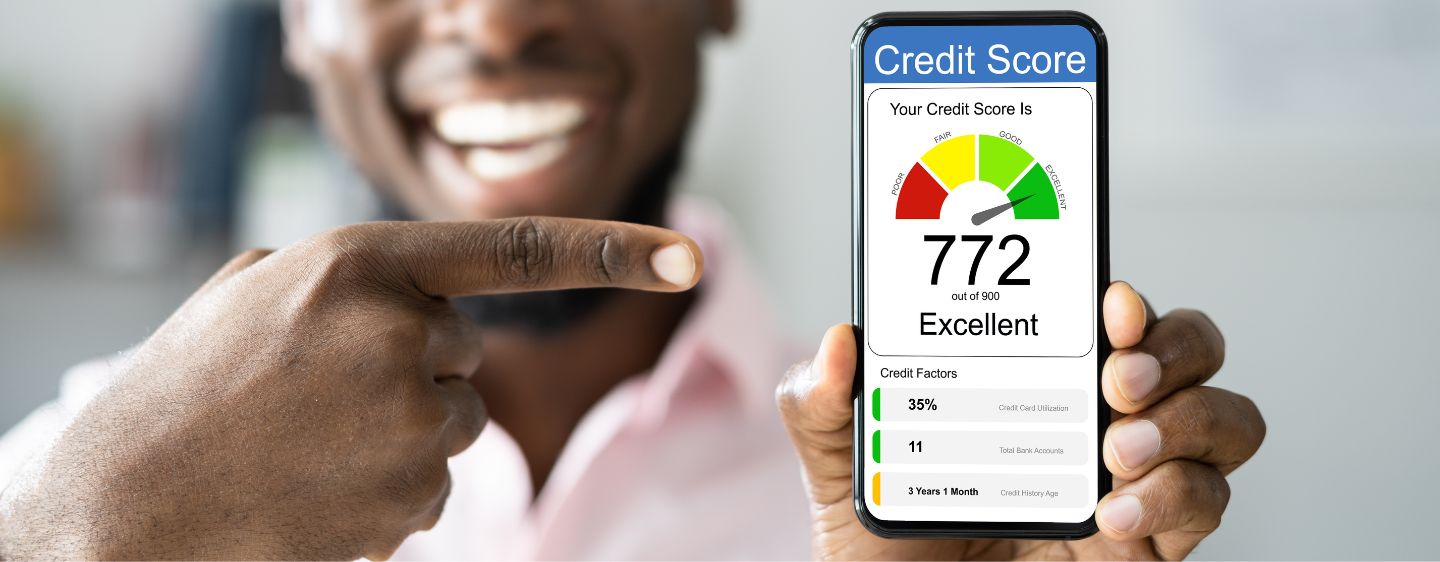 Man pointing at phone showing credit score.