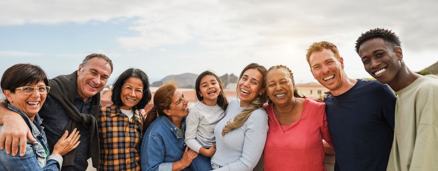 Group of individuals smiling together.