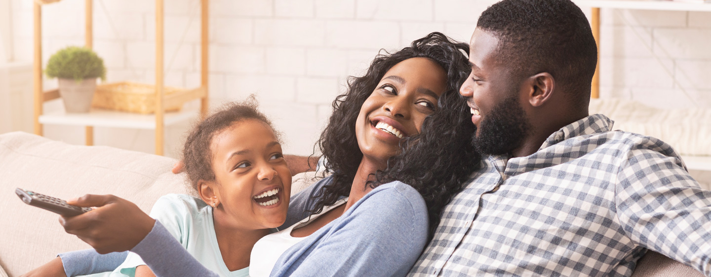 Family resting on a couch.