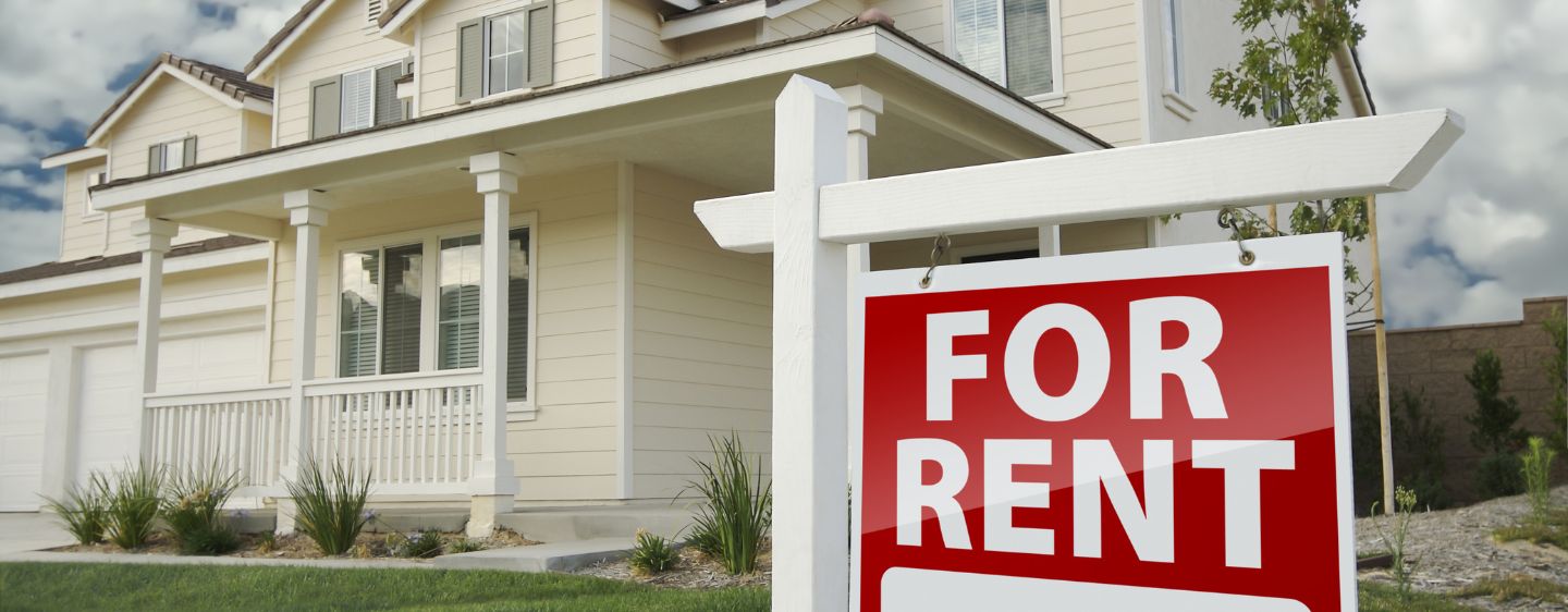 House with for Rent Sign out front. 