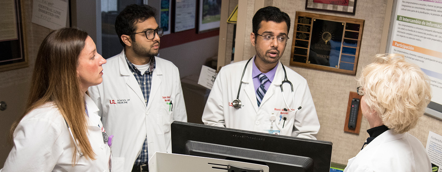 U of L Faculty and students talking at U of L Hospital.
