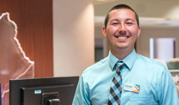 An employee smiles.