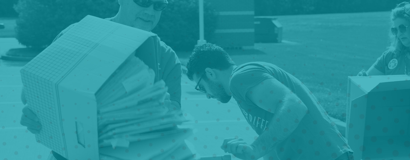 People helping with shred day.