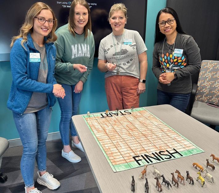 HR playing Derby themed Game.