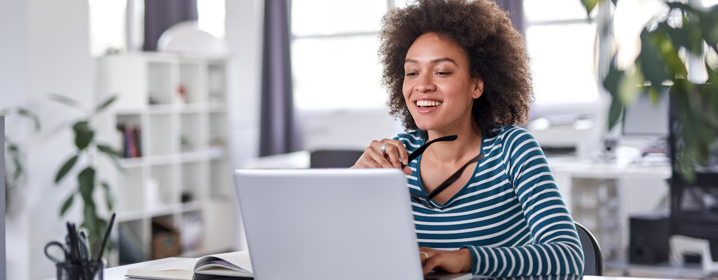 Woman on a laptop.