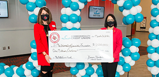 Karen Harbin and Neeli Bendapudi during check presentation at the University of Louisville.