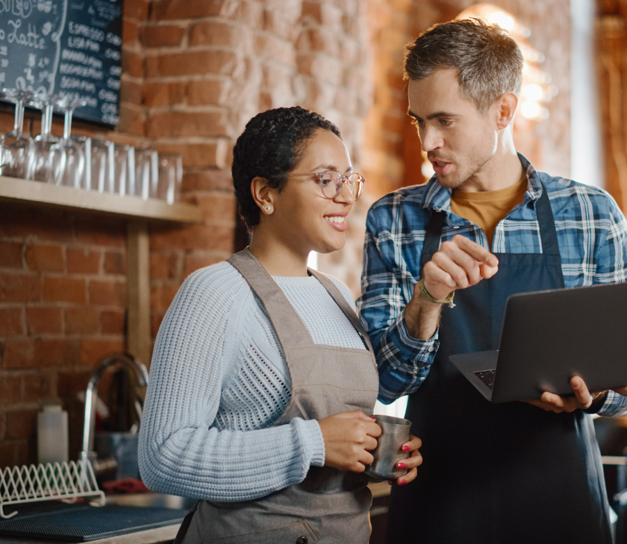 Image of man and woman who work in a coffee shop together for Kentucky Small Business Tax Credit Program slider