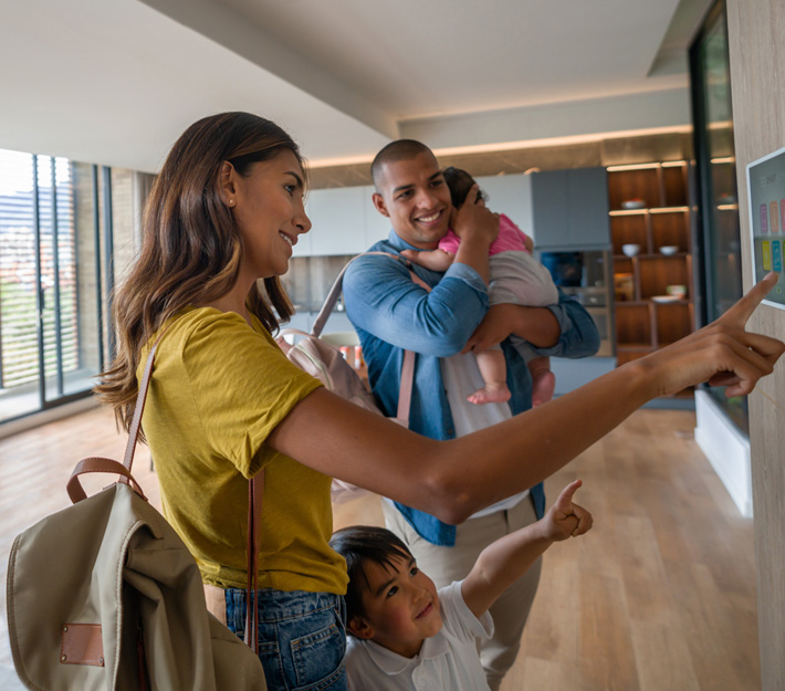 Family sets their security alarm before leaving.