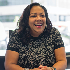 CCU employee smiles at a member.