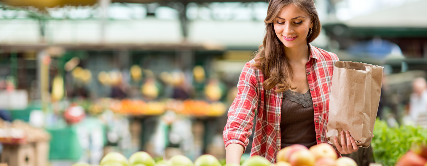 Woman shopping for produce.