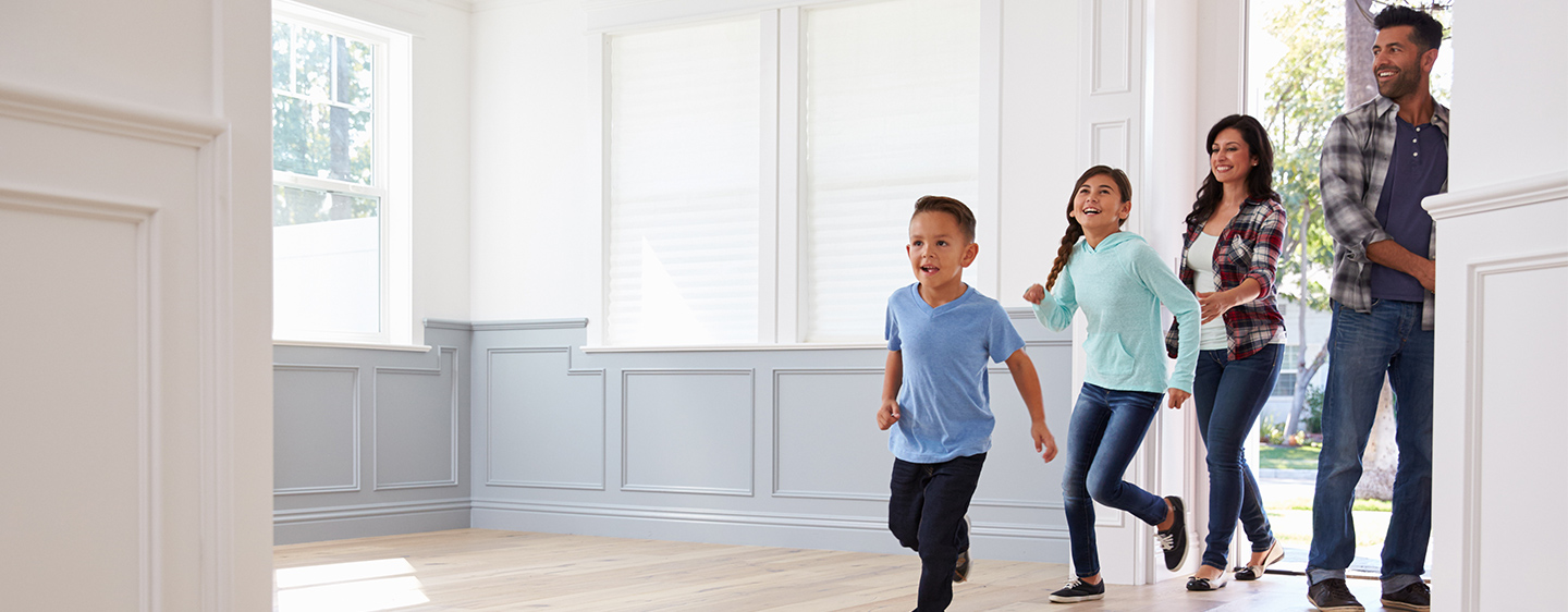 Family walking into their new home for the first time.