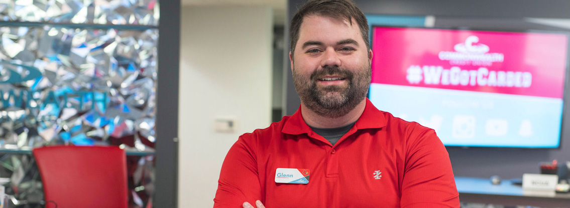 A CCU employee smiles at the camera.