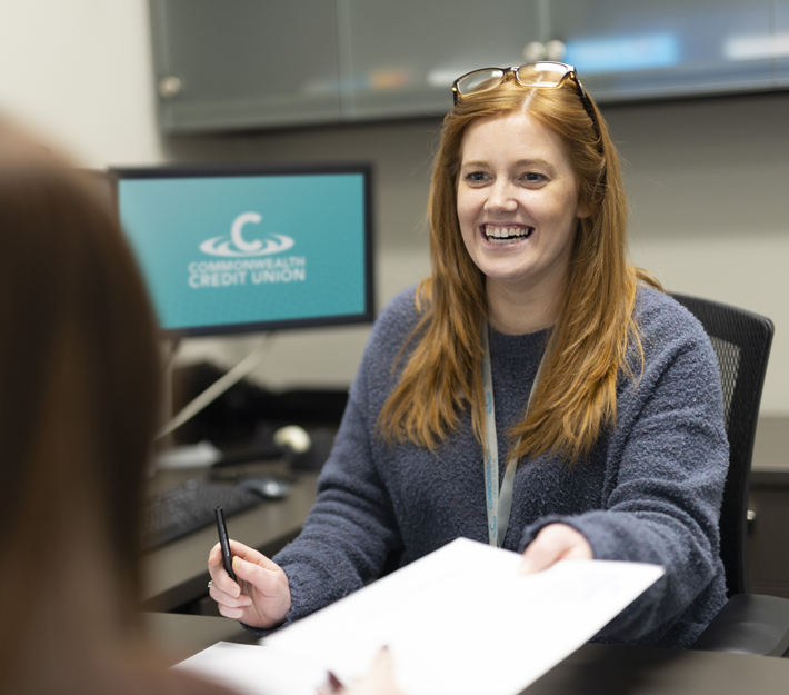 Louisville Road Branch employee smiles while assisting a member