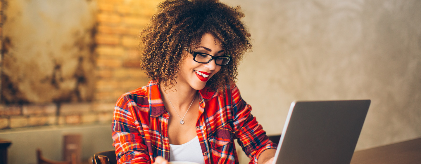 Woman using a laptop.