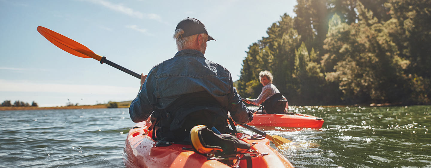 Man and woman kayaking on the river.