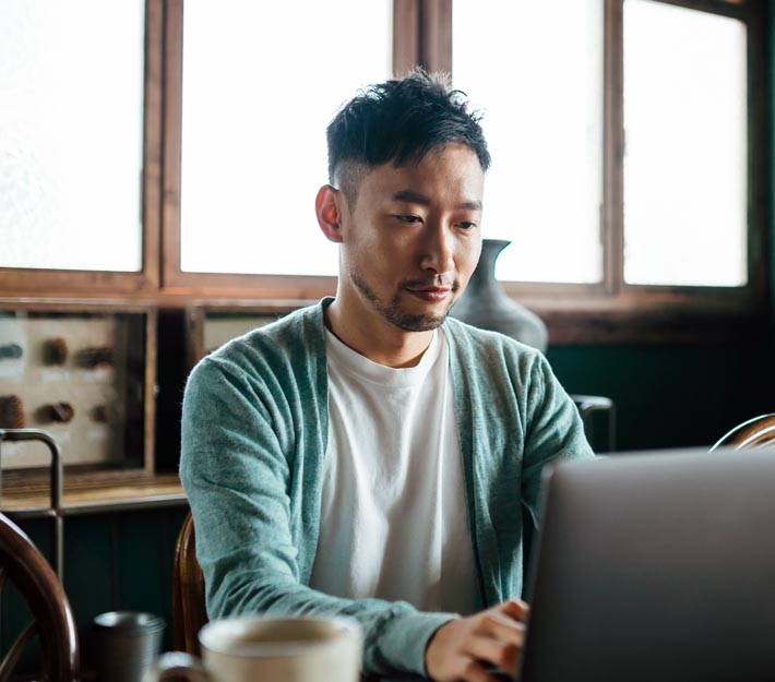 Man works on laptop