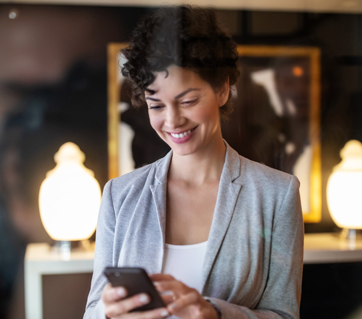 Woman uses a cellphone.