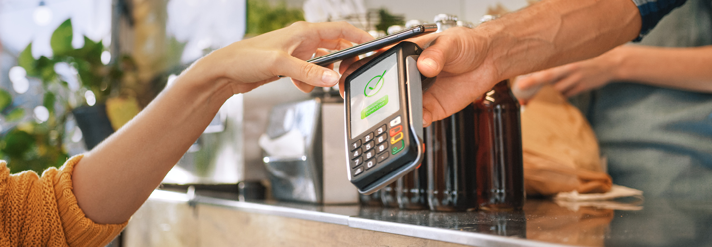 Person using mobile wallet at a food truck.